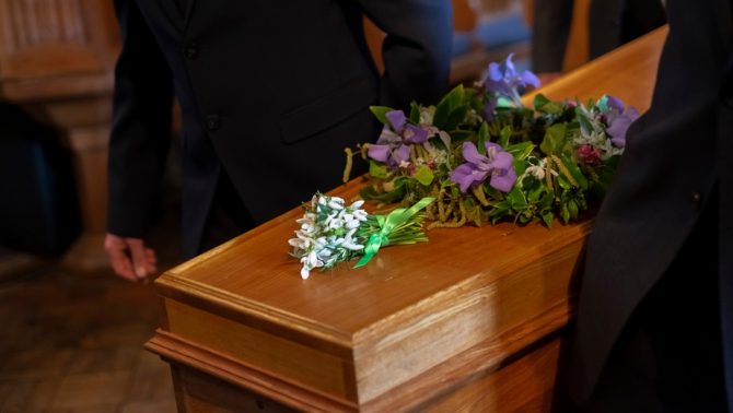 Flowers and coffin at a funeral service